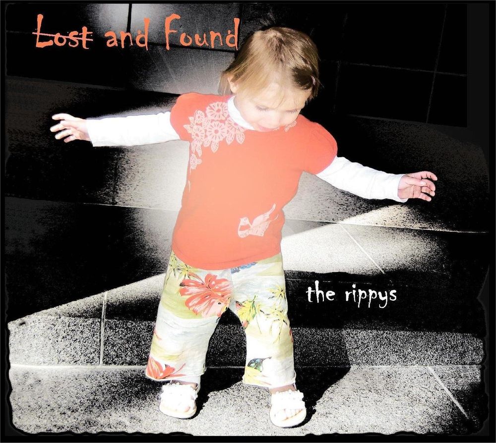 Lost and Found album cover: a toddler in a red shirt and flowered pants takes steps across sunlit tiles, arms out for balance.